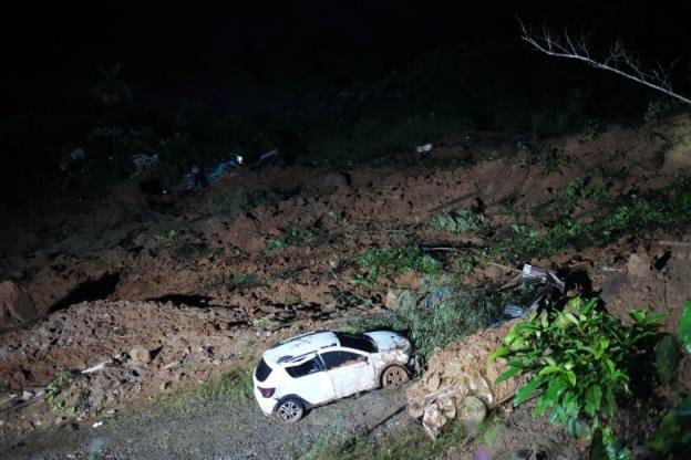 A damaged car is seen at the site of a deadly mudslide in Colombia's Choco province.