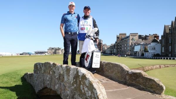 Mark Power poses with his caddie on the ico<em></em>nic Swilcan Bridge at St Andrews Old Course ahead of the Walker Cup