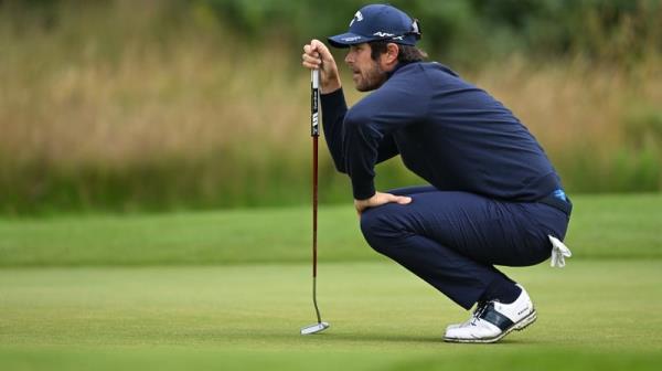 Nacho Elvira lines up a putt on the second hole