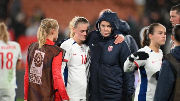 Mathilde Harviken of Norway is co<em></em>nsoled by the injured Ada Hegerberg