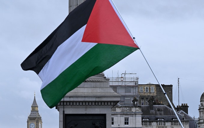 A Palestinian flag is waved during the 'Lo<em></em>ndon Rally For Palestine' in Trafalgar Square