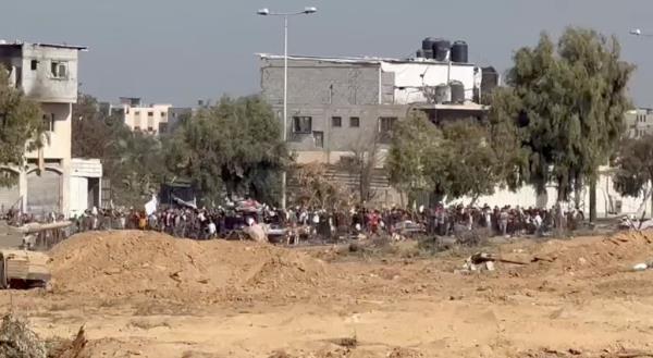 Palestinians wave white flags to surrender in northern Gaza as Israeli troops approach.