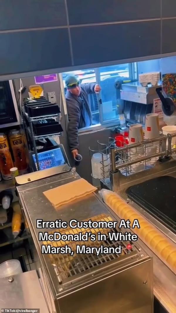 An unidentified man stormed up to a McDonald's drive-thru window in White Marsh, Md., and hurled a large soda at workers while demanding 