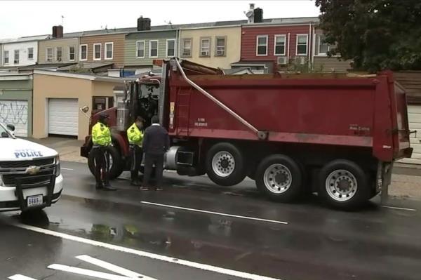 Police investigate the dump truck