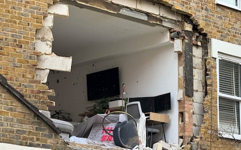 A woman was rescued from the flat and treated in hospital