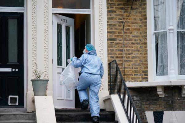 Forensic officers at a property on Mo<em></em>ntague Road in Dalston, east London, wher<em></em>e a four-year-old boy has died after suffering knife injuries. 