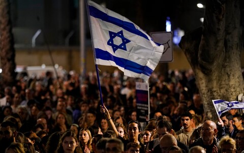 People participate in a show of solidarity near the Museum of Art in Tel Aviv