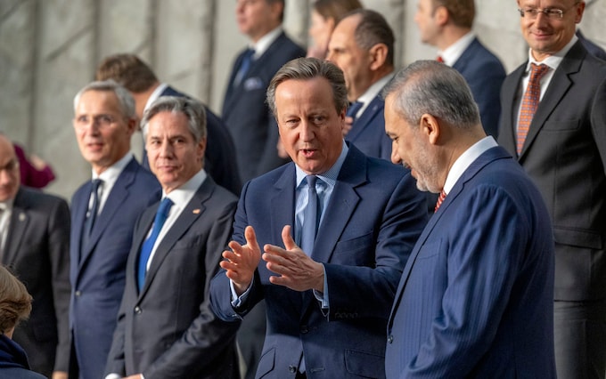 NATO Secretary General Jens Stoltenberg, and Anthony Bl<em></em>inken (US Secretary of State) watch David Cameron (UK Secretary of State for Foreign Affairs) and Hakan Fidan of Turkey in conversation