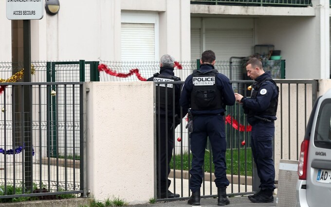 French police stand outside the building wher<em></em>e five bodies were found dead in Meaux, east of Paris
