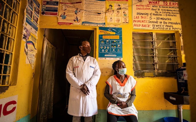 Nurse Jacqueline Nzau (l) and colleague at the Mercilin Afya Centre, Kibera, during the pandemic