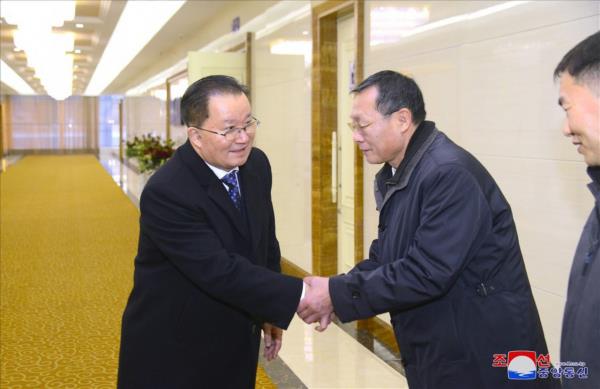 Kim Son-kyong (left), North Korea's vice foreign minister for internatio<em></em>nal organizations, departs Pyo<em></em>ngyang to attend the Non-Aligned Movement summit in Uganda. (KCNA)