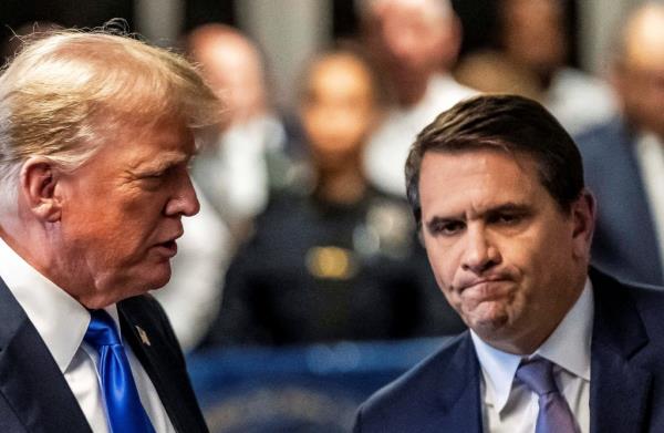 Former U.S. President Trump walks alo<em></em>ngside his attorney Todd Blanche after a jury found him guilty of all 34 felony counts in his criminal trial.