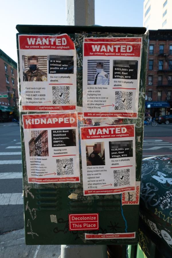 Anti-police fliers hanging on a traffic sensor box corner of 1st Ave. and 9th Street