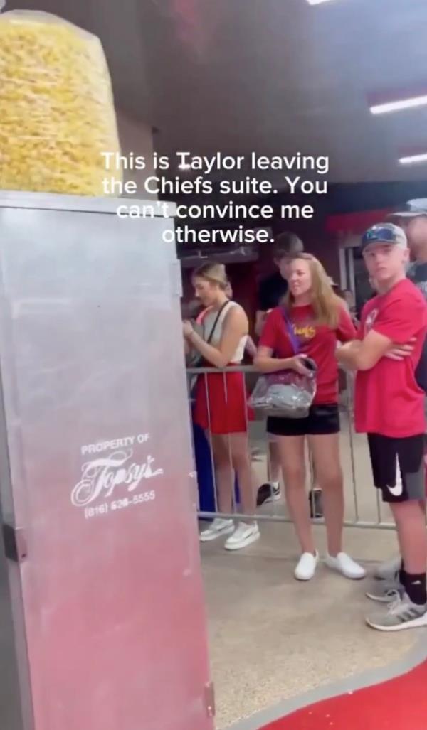 In a video uploaded by TikTok user Cassie Musfeld, Arrowhead Stadium staff can be seen wheeling a massive gray box adorned with a giant bag of popcorn down a hallway while fans gather around a barricade.