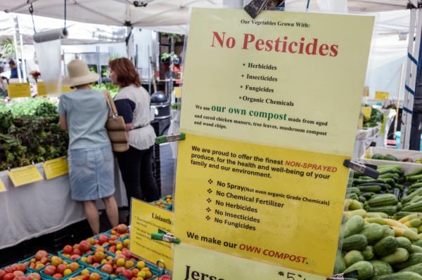New York City, Dag Hammarskjold Plaza Greenmarket, No Pesticides Sign.