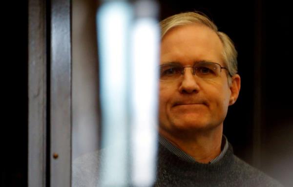 Former U.S. Marine Paul Whelan, who was detained and accused of espionage, stands inside a defendants' cage during his verdict hearing in Moscow, Russia June 15, 2020.