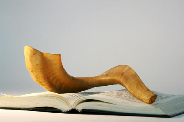 Shofar on a bible book at Rosh Hashanah