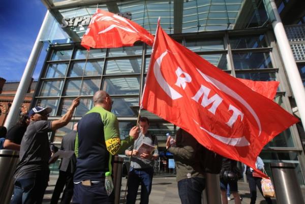 RMT flags fly at the official picket outside St Pancras Internatio<em></em>nal station 