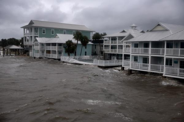 Flood waters reach far up a stop sign in Florida following Hurricane Debby