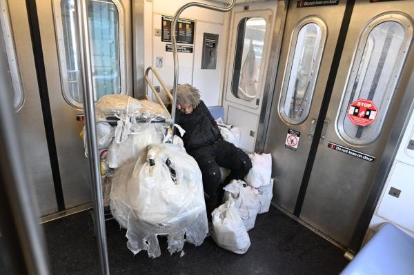 A homeless person on the number 4 train
