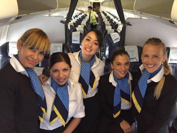 Carbone and fellow flight attendants inside a plane