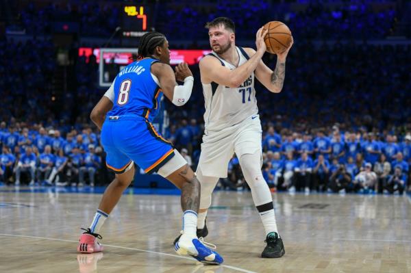 Dallas Mavericks guard Luka Do<em></em>ncic (77) works the floor against Oklahoma City Thunder forward Jalen Williams (8) during the first half in Game 2 of their second-round playoff series, May 9, 2024, in Oklahoma City.  