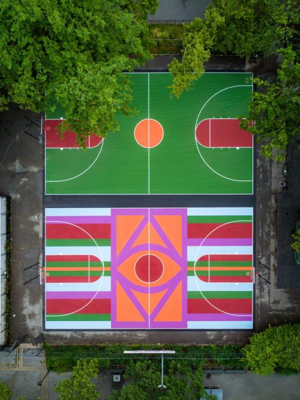 A basketball court surrounded by trees, photo by Austin Bell.
