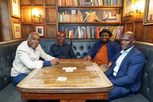 Dale Davis, Hawi Gondwe, Ade Omotayo and Nathan Allen of the Amy Winehouse Band sitting around a table at the Hawley Arms in London, photographed on September 13, 2023.