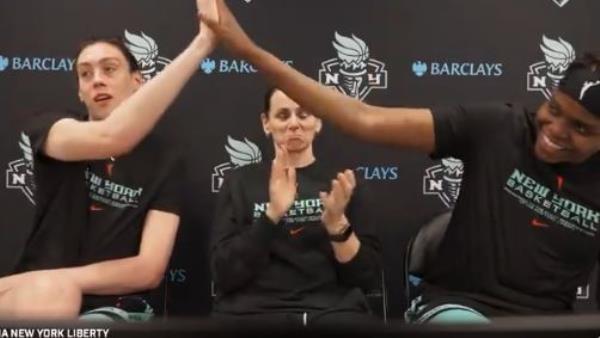 Liberty star Breanna Stewart (l.) high-fives teammate Jo<em></em>nquel Jo<em></em>nes over the news the WNBA will be chartering flights for all teams this season. 