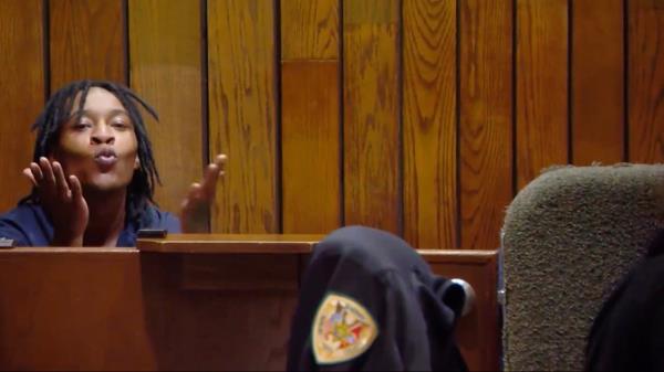 Ja'Marcus Odell sneers in a courtroom.