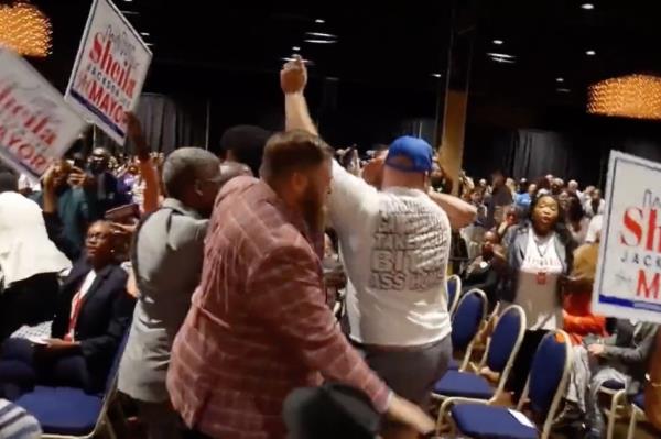 Audience members loudly drowned out Rosen's questions
