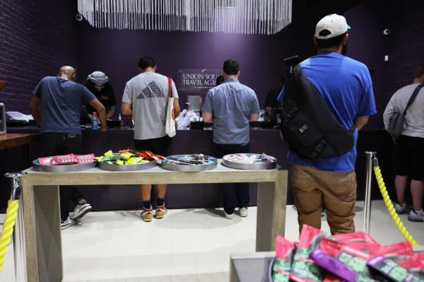 People standing in line before a counter