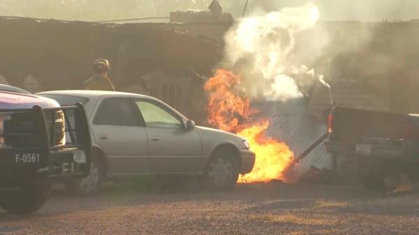 The fire damaged power lines and caused a temporary power outage, according to reports.