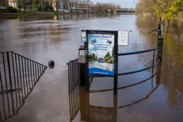 Flooded area in York, England, with a sign, caused by Storm Bert