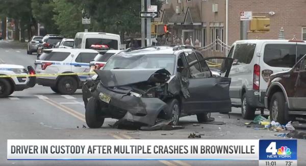 a black minivan is seen with a smashed bonney