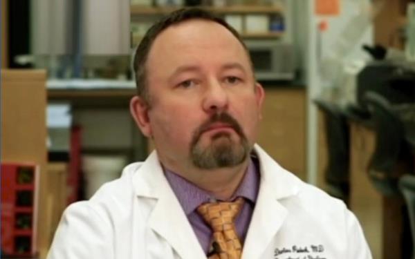A doctor in a white lab coat