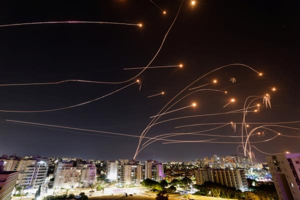 Israel's Iron Dome anti-missile system intercepts rockets launched from the Gaza Strip, as seen from the city of Ashkelon, Israel October 8, 2023. 
