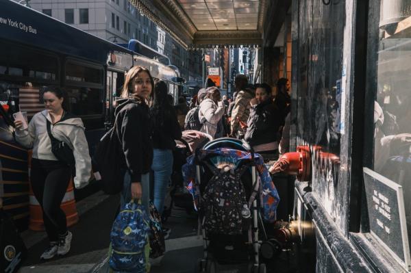 Migrants seeking asylum in the United States gather outside