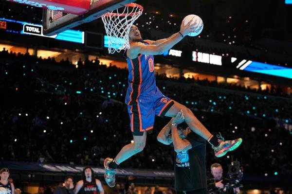 Jacob Toppin finishes off an impressive slam during the NBA's Slam Dunk Contest.