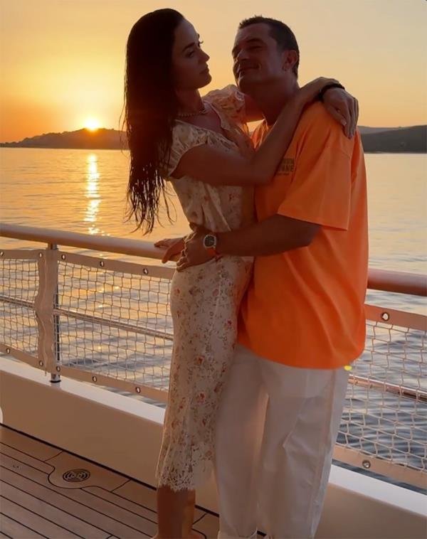 Orlando Bloom and Katy Perry hugging on a boat during vacation
