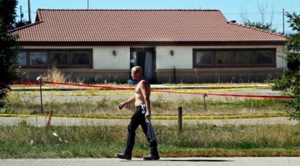 James Glidewell walks past the Return To Nature Funeral Home in Penrose, Colo. Thursday, Oct. 5, 2023. Authorities said Thursday they were investigating the improper storage of human remains at a southern Colorado funeral home that performs ?green? burials without embalming chemicals or me<em></em>tal caskets. (Jerilee Bennett/The Gazette via AP)