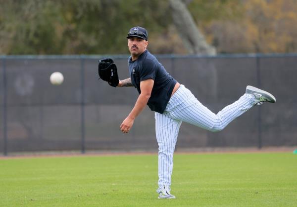 New York Yankees starting pitcher Nestor Cortes #65, throwing in the outfield during practice at Steinbrenner Field, the Yankees Spring training complex in Tampa Florida.