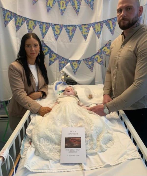PRINT BEFORE WEB collect pictures of baby Indi Gregory at her Christening. Pictured also with parents Dean and Claire Staniforth