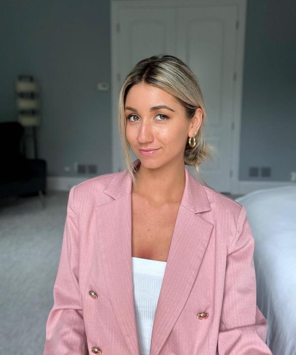 Piper Phillips in pink blazer