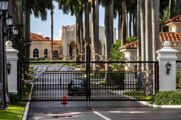 Closed gates of the Trump Internatio<em></em>nal Golf Club in West Palm Beach with palm trees and a car in the background, scene of a FBI investigation into an attempted assassination of former President Do<em></em>nald Trump