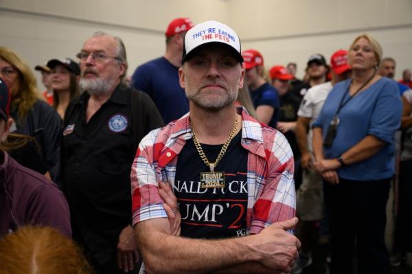 A supporter attentively listening to former President Do<em></em>nald Trump speak at a campaign rally in Erie, Pennsylvania on September 29, 2024.