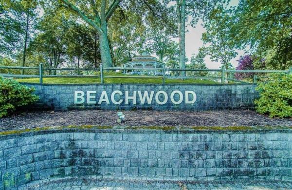 The entranceway to Beachwood Beach West in Beachwood in Toms River New Jersey features a stone block plaza with a sign that says 