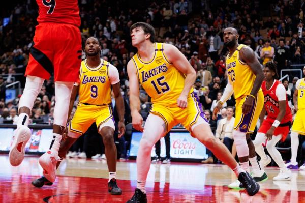 Bro<em></em>nny James #9 and LeBron James #23 of the Los Angeles Lakers defend against the Toro<em></em>nto Raptors during the second half of their NBA game at Scotiabank Arena on Nov. 1.