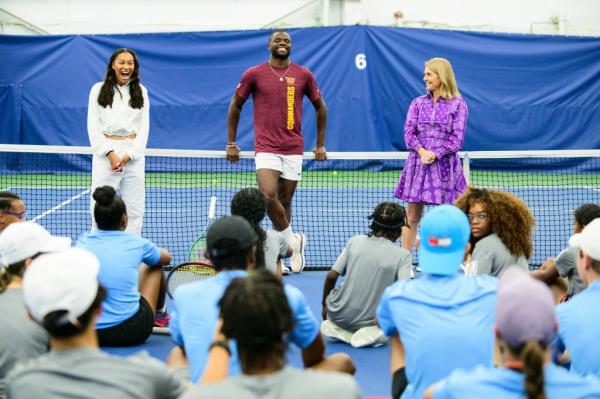 Frances Tiafoe, who will enter the U.S. Open next week ranked 20th in the world, laughs while teaching youngsters during a clinic for the Natio<em></em>nal Junior Tennis League.