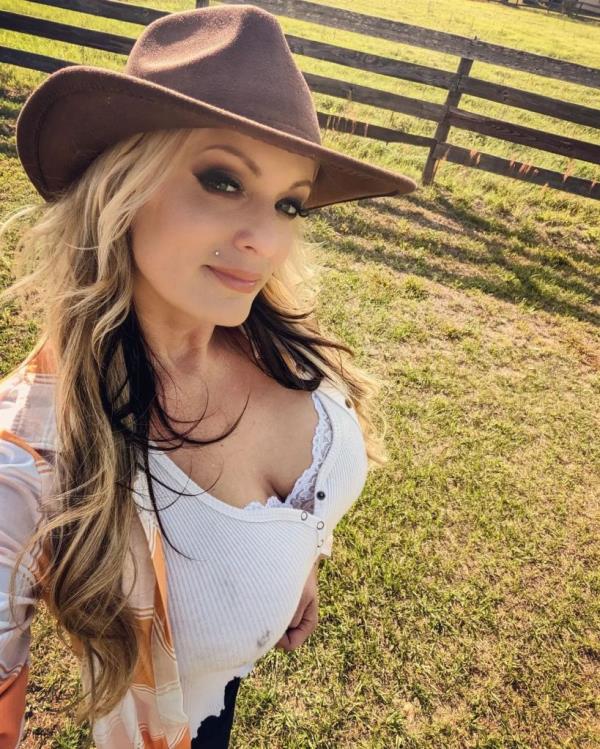 Stormy Daniels in a selfie on a ranch. 
